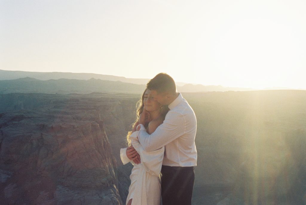 A close-up photo of a couple on a mountain.
