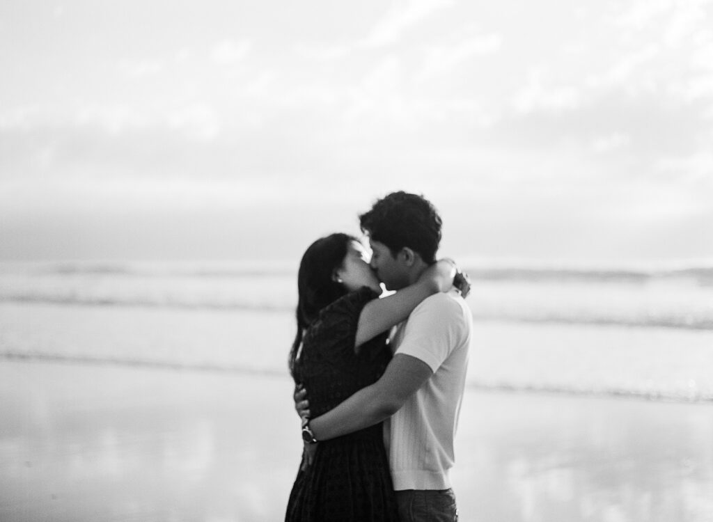 cinematic couples session at solana beach on film in black and white