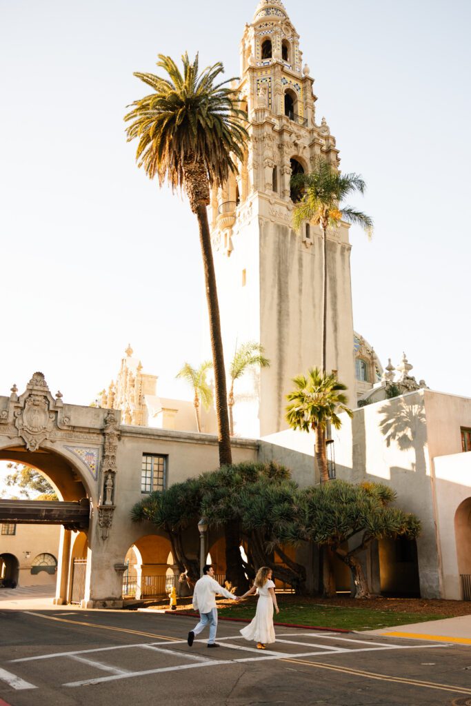 Balboa Park Engagement Session surrounded by beautiful architecture and palm trees