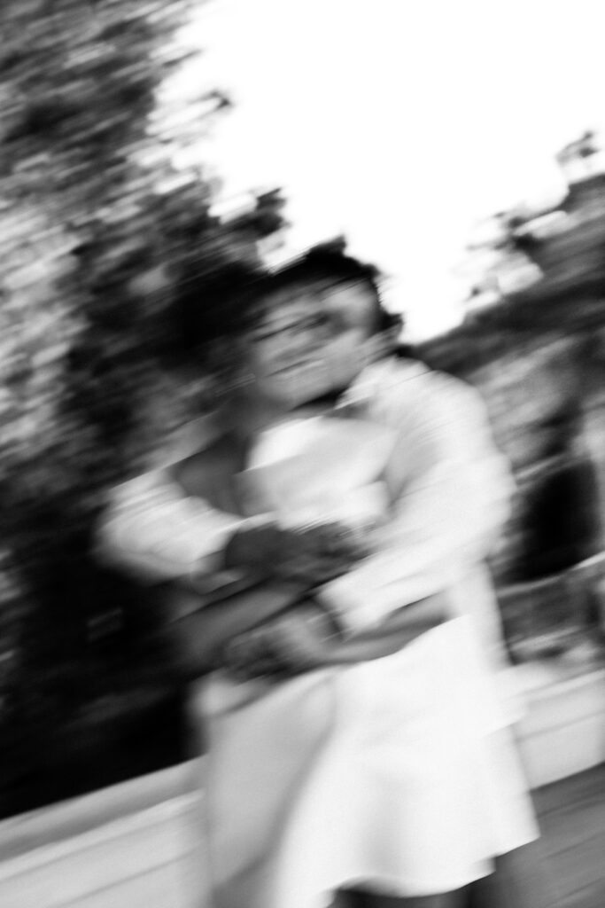 engagement photos surrounded by the gorgeous architecture at balboa park with motion blur