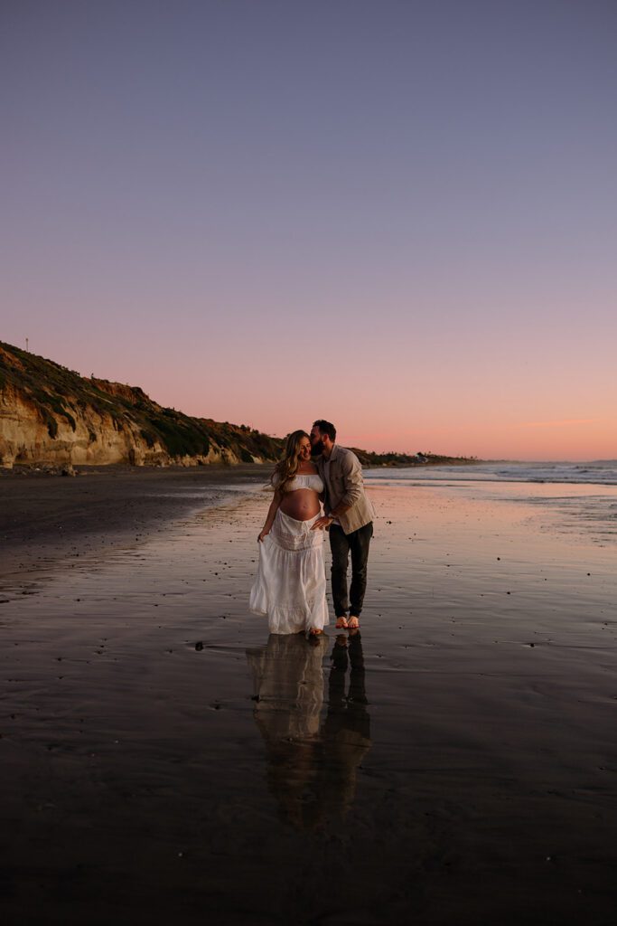 cinematic maternity photos on the beach
