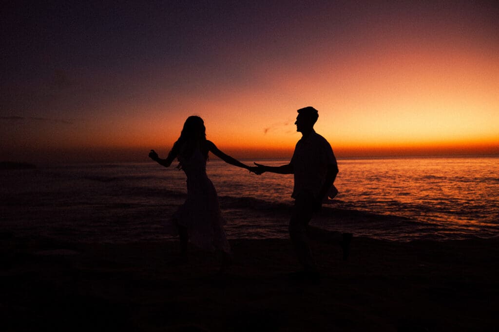 cinematic couples photos at sunset on the beach