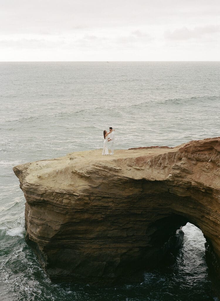 film engagement photos of couple at sunset cliffs in san diego, ca
