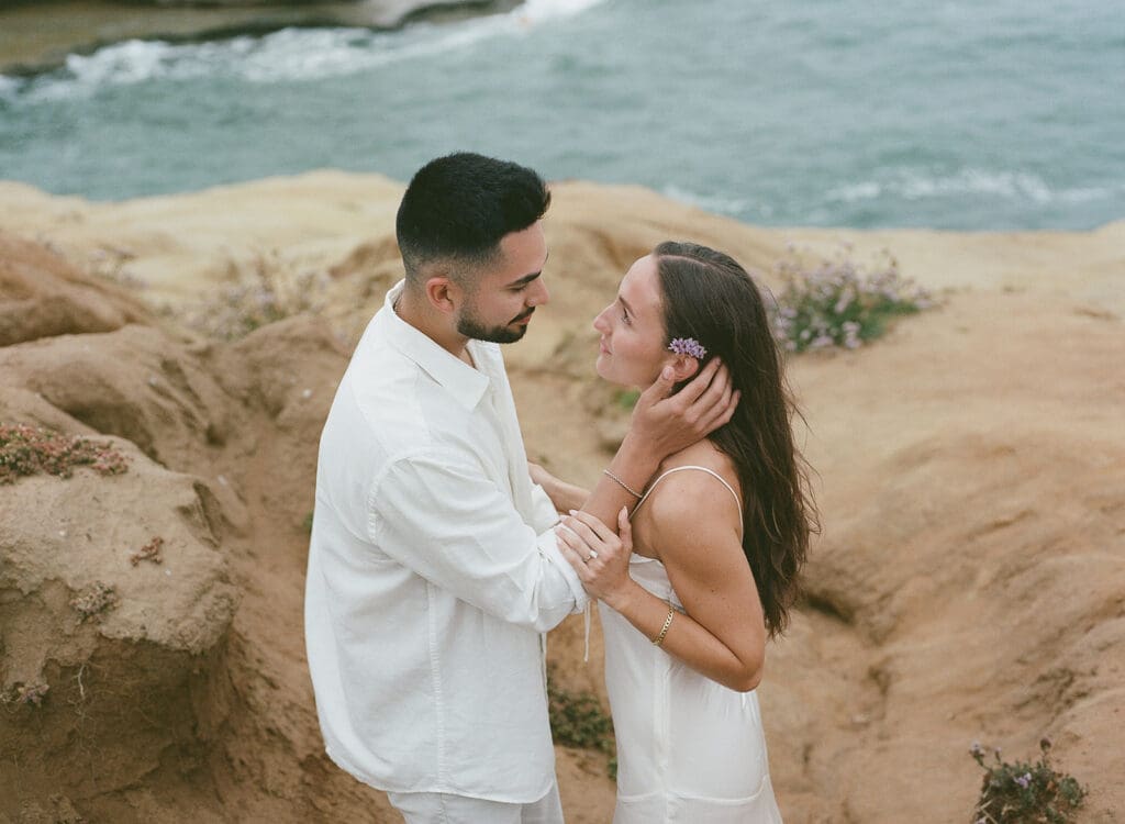 film engagement photos of couple at sunset cliffs in san diego, ca
