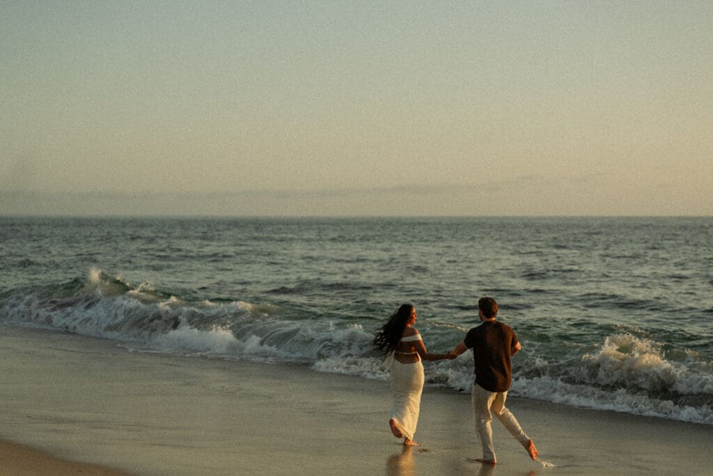 dancing on the beach during a Windansea Beach proposal at sunset