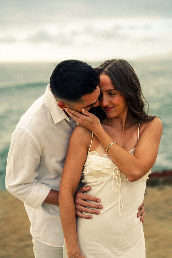 cinematic couples photos from a Cloudy Sunset Cliffs Engagement Session