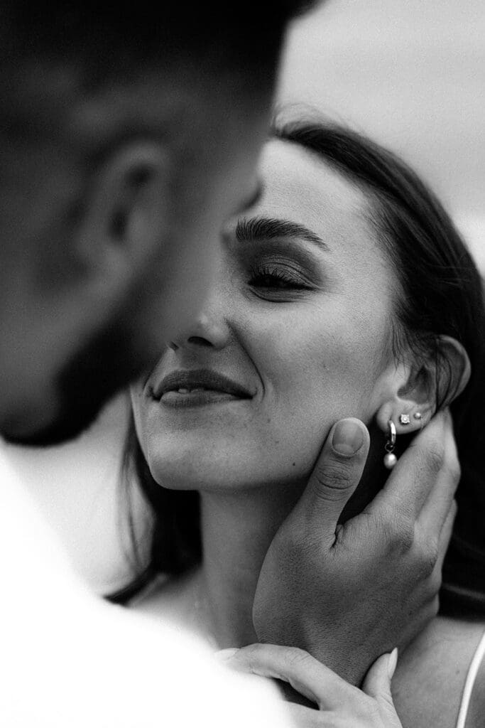 cinematic couples photos from a Cloudy Sunset Cliffs Engagement Session in black and white