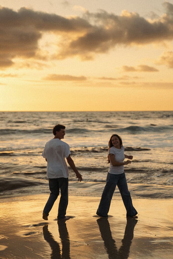 cinematic couples portraits on the beach at golden hour
