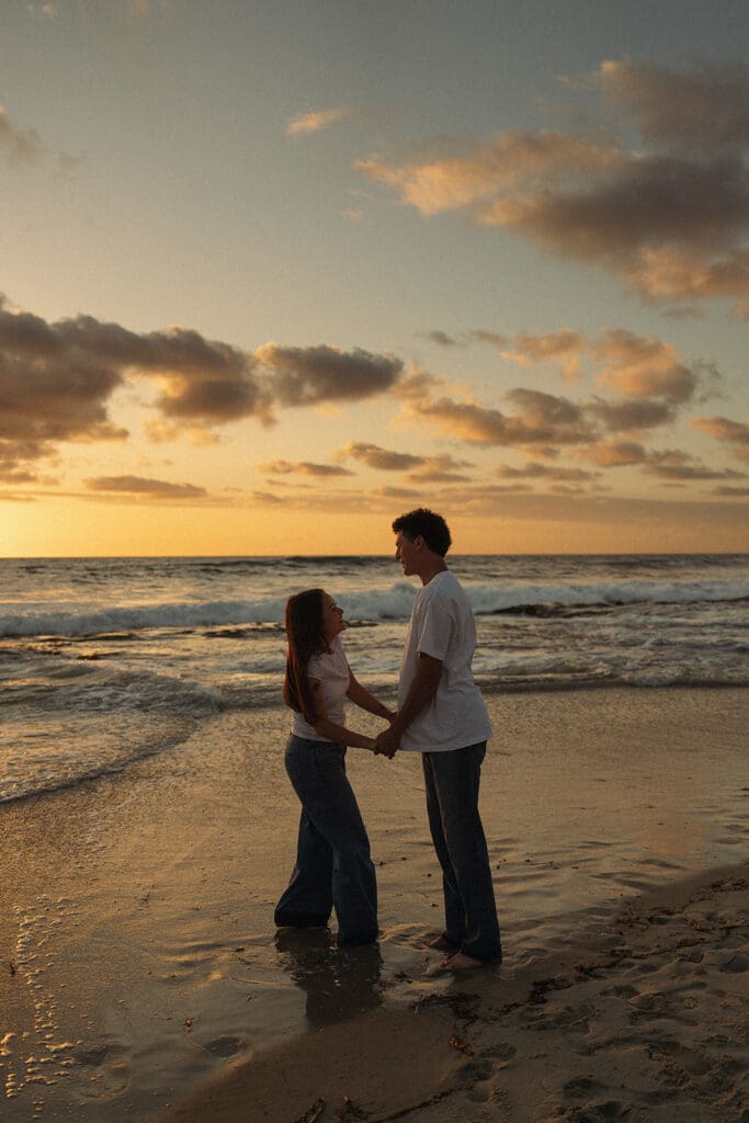 cinematic couples portraits on the beach at golden hour