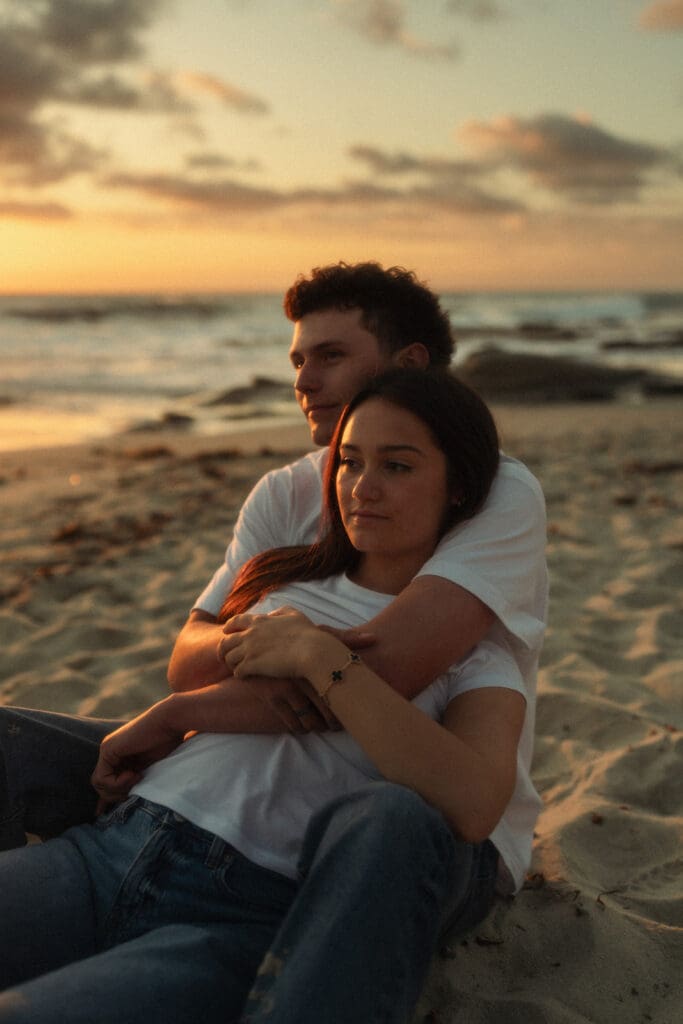 cinematic couples portraits on the beach at golden hour